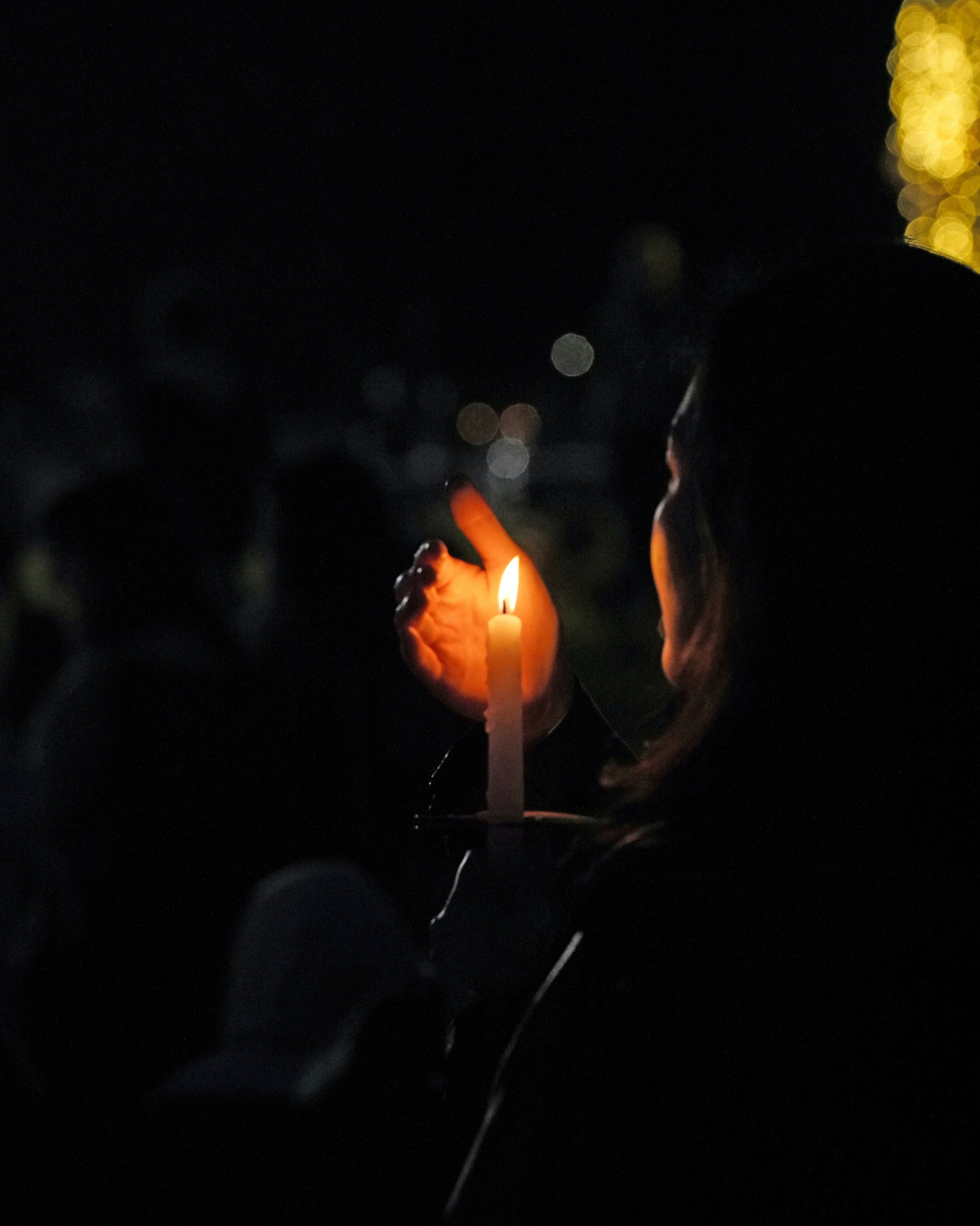 Christian woman holding a candle