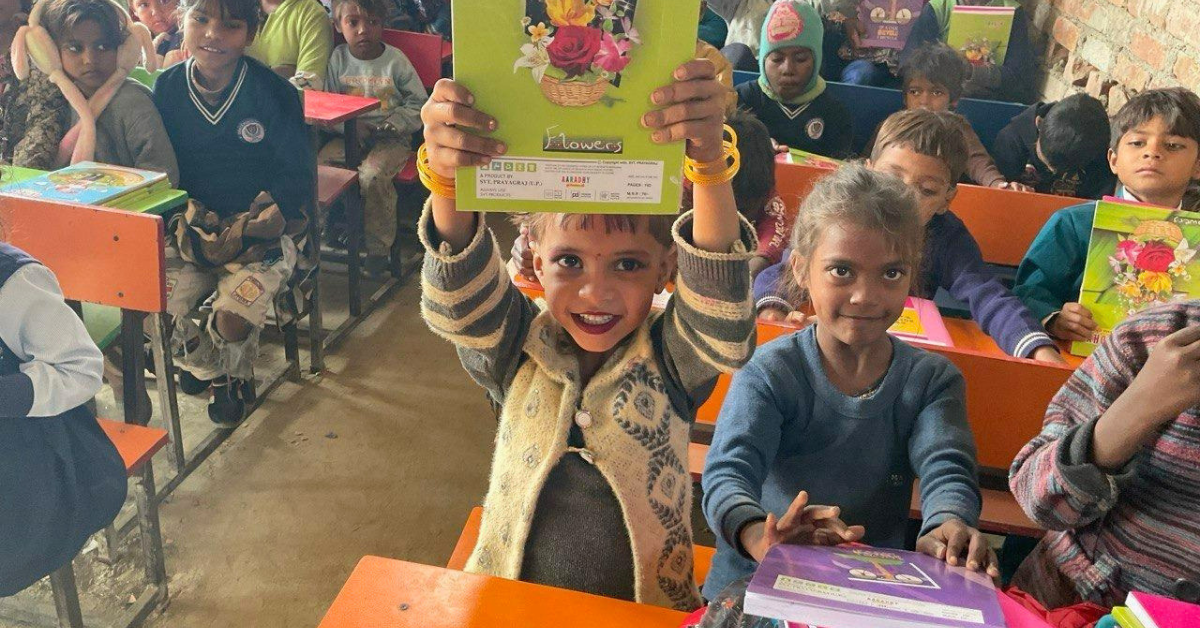 Children from a beggar community in India receive text books and Bibles in their new school
